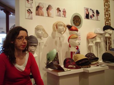 Karen Henriksen with her hats and caps