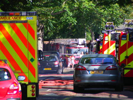 Fire engines, ambulances and police vans parked in