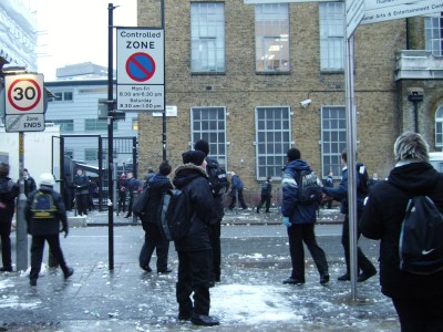 Snowball fight outside London Nautical School