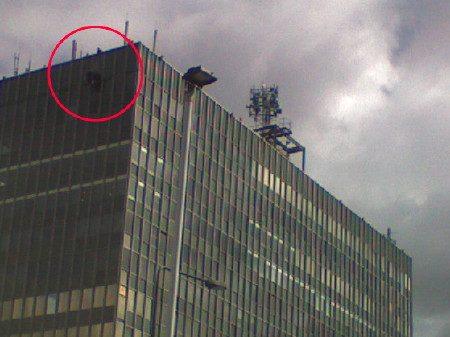 Abseilers remove the broken cladding panel