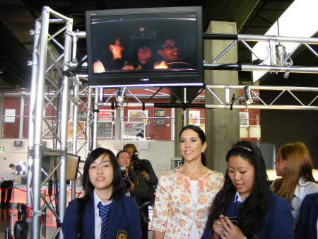 The Princess with schoolchildren alongside the car