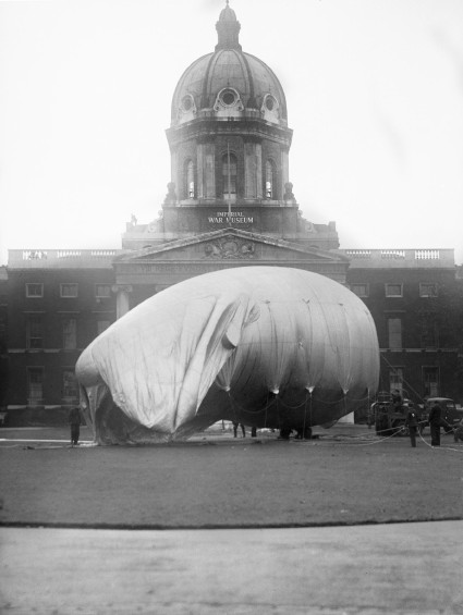 A barrage balloon is inflated outside the Imperial