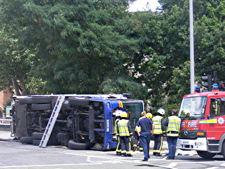 Dust cart overturns at Lambeth Bridge roundabout