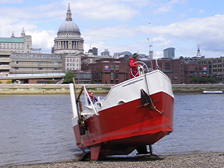 Walking Boat emerges from the Thames onto Bankside beach