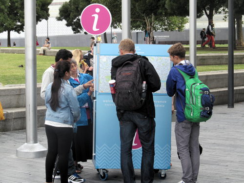 Volunteers offer tourist information outside City Hall